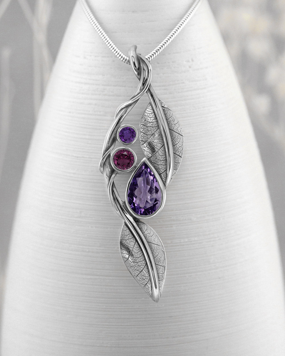 Handmade silver and gemstone leaf and tendril pendant - woodland and leaf pendant - purple and pink gemstones - recycled silver
