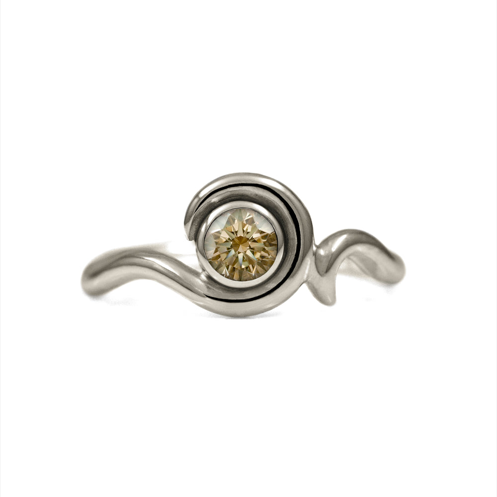 Entwine engagement ring handmade in recycled 18ct white gold and set with an ethically sourced natural champagne diamond. Delicate 2mm band with a 4.5mm 0.35ct diamond. Handmade in Salisbury, Wiltshire.