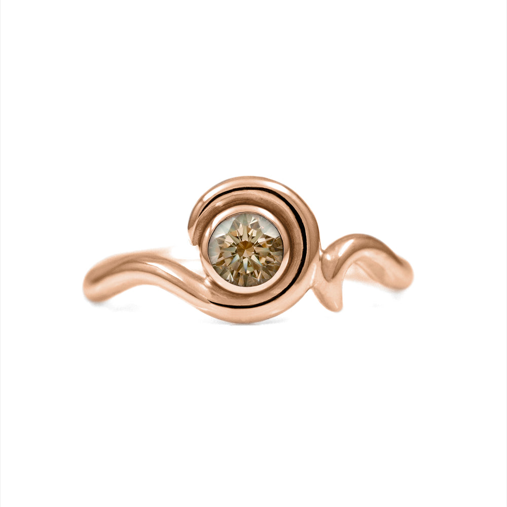 Entwine engagement ring handmade in recycled 18ct rose gold and set with an ethically sourced natural champagne diamond. Delicate 2mm band with a 4.5mm 0.35ct diamond. Handmade in Salisbury, Wiltshire.