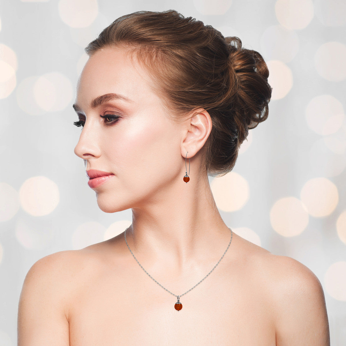 Sterling silver and red carnelian acorn pendant. Can also be worn with silver leaf pendants and silver rose pendants. Handmade using recycled silver in Salisbury, Wiltshire.