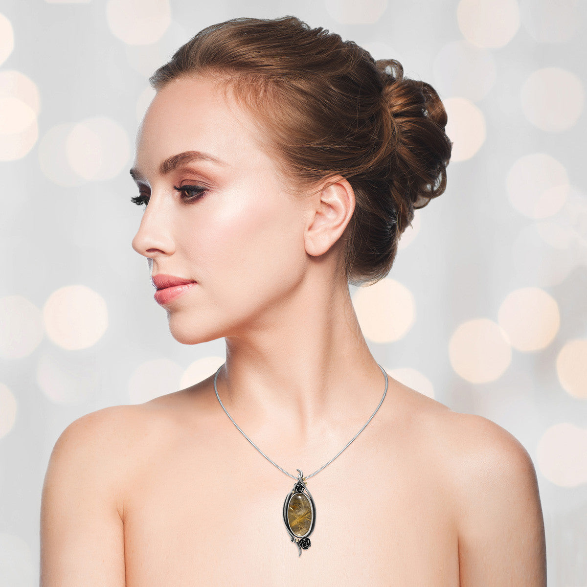 Sterling silver and 9ct gold rose pendant with rutilated quartz