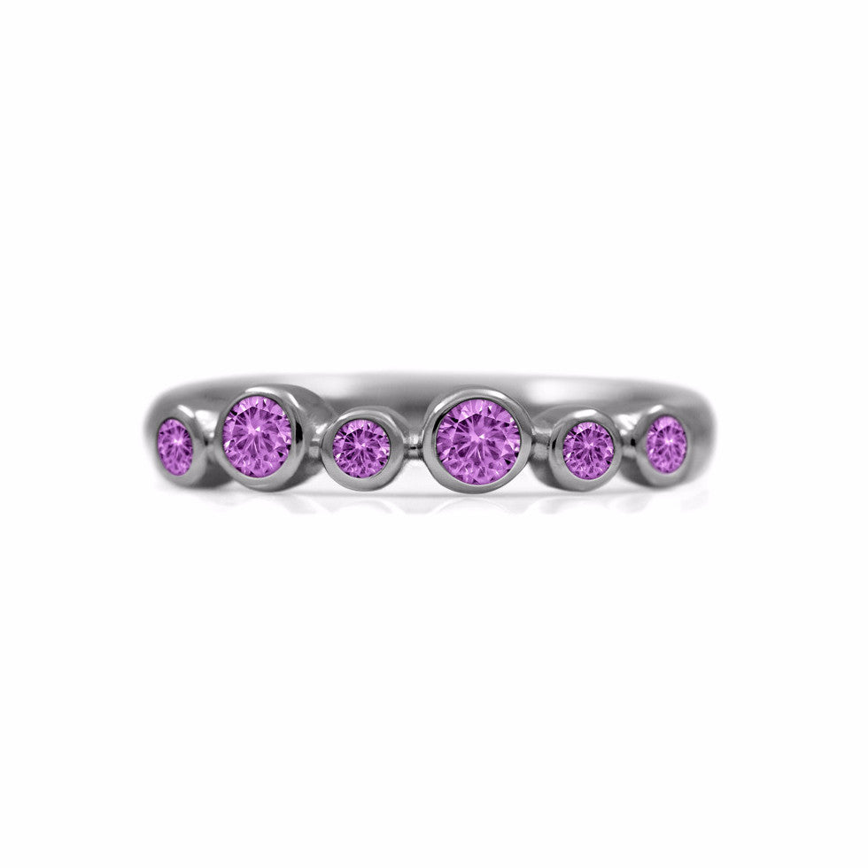 Halo half eternity ring - sterling silver and pink sapphire