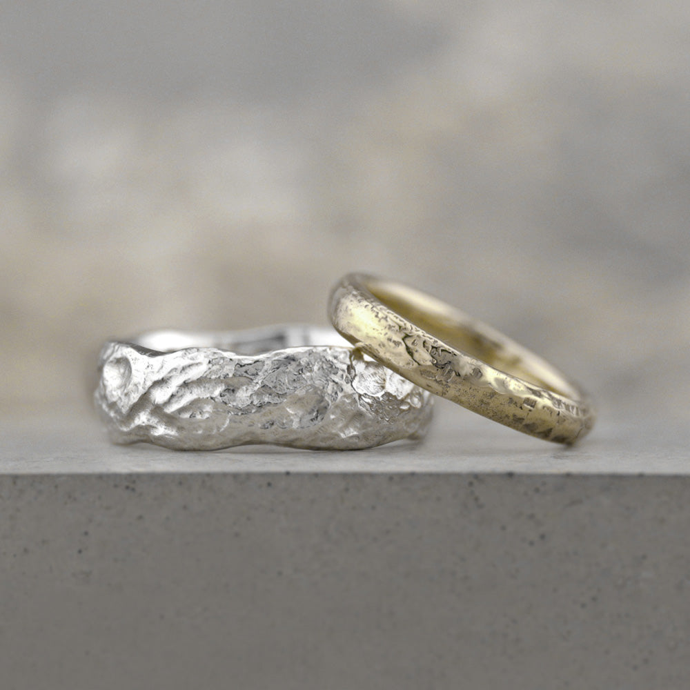 Handmade molten wedding rings in gold and platinum - rustic texture