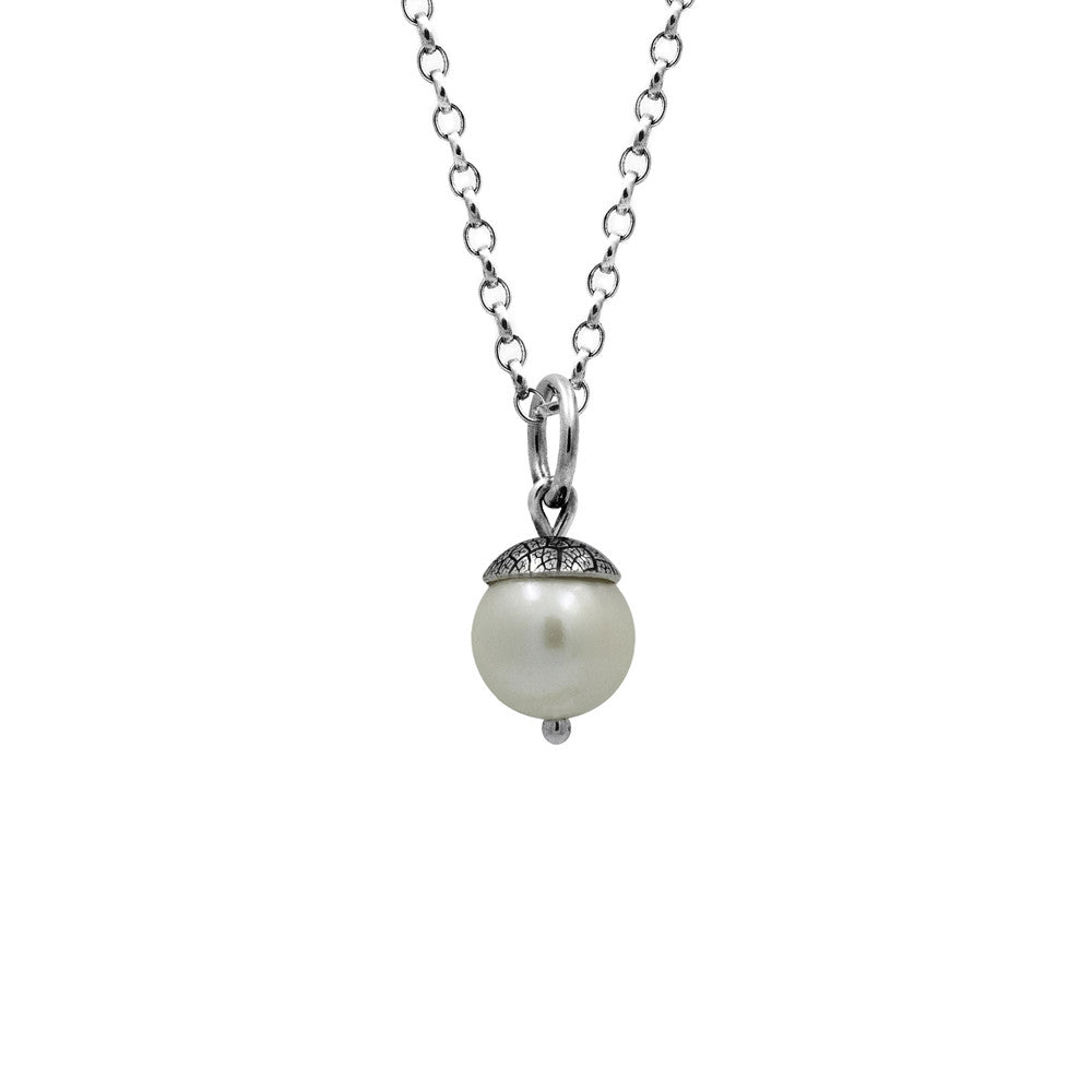 Sterling silver and white freshwater pearl acorn charm pendant.  Can also be worn with silver leaf pendants and silver rose pendants. Handmade using recycled silver in Salisbury, Wilthshire.