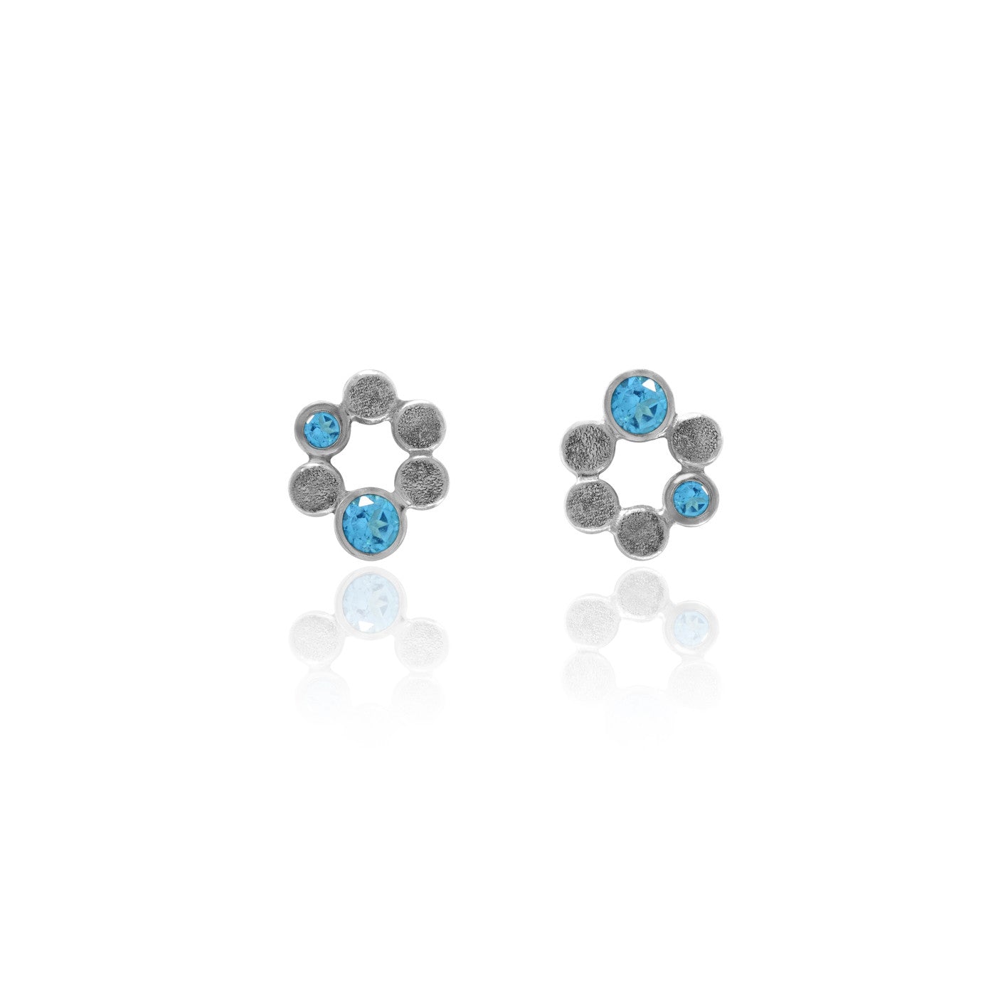 Small halo earrings in sterling silver and blue topaz - ready to wear