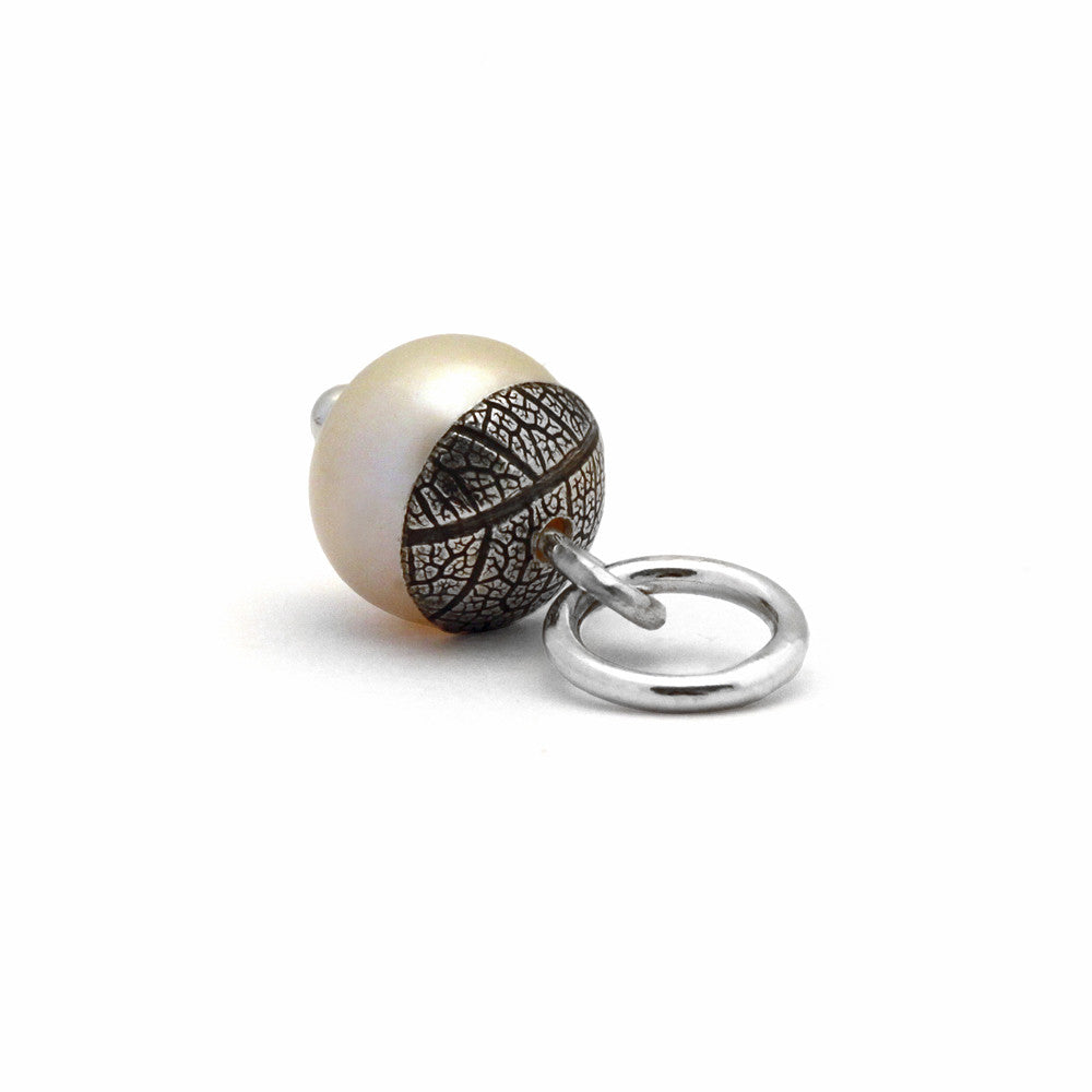 Sterling silver and white pearl acorn pendant.  Can also be worn with silver leaf pendants and silver rose pendants. Handmade using recycled silver in Salisbury, Wiltshire.