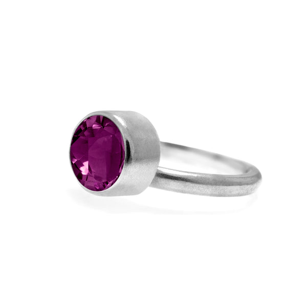 Pair of interlocking halo rings in sterling silver, pink garnet and amethyst