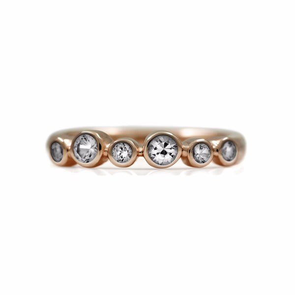 Halo half eternity ring - 9ct rose gold and white topaz