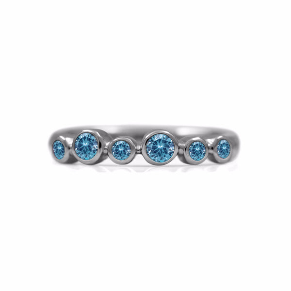 Halo half eternity ring - sterling silver and blue topaz