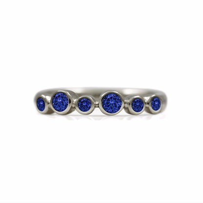 Halo half eternity ring - 9ct white gold and blue sapphire