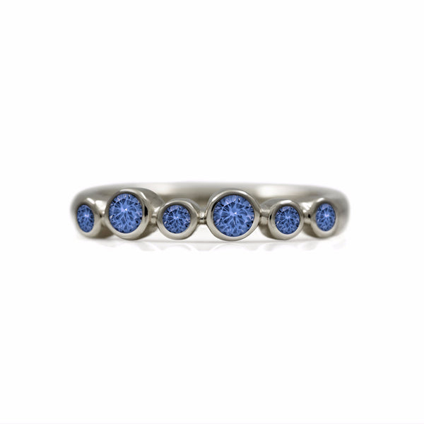 Halo half eternity ring - 9ct white gold and blue sapphire