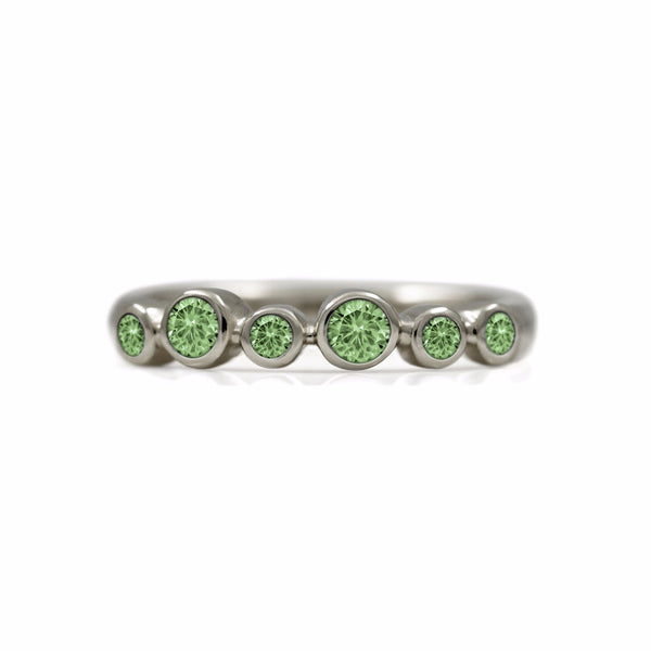 Halo half eternity ring - 9ct white gold and green sapphire