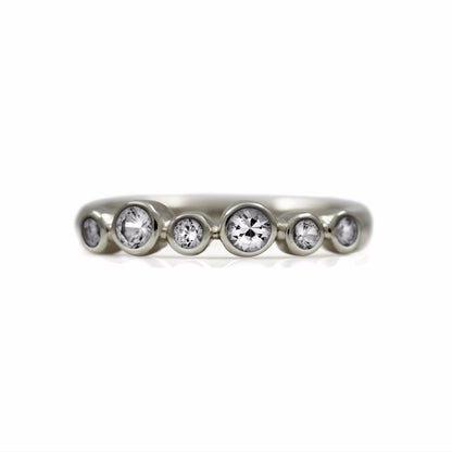 Halo half eternity ring - 9ct white gold and white sapphire